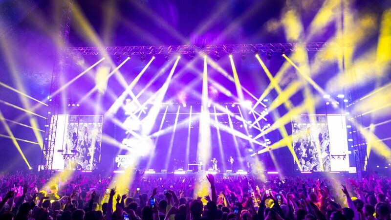 Concert crowd under stage lights at a music festival