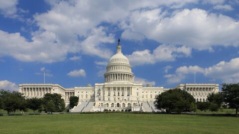 United States Capitol building west side under a blue sky