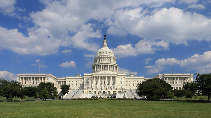 United States Capitol building west side under a blue sky