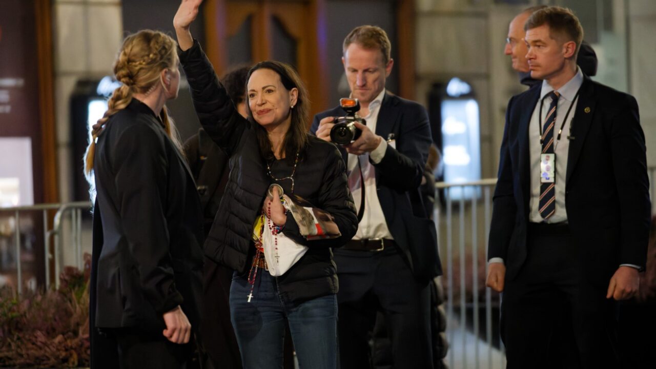 Maria Corina Machado waving to supporters during Nobel Week 2025