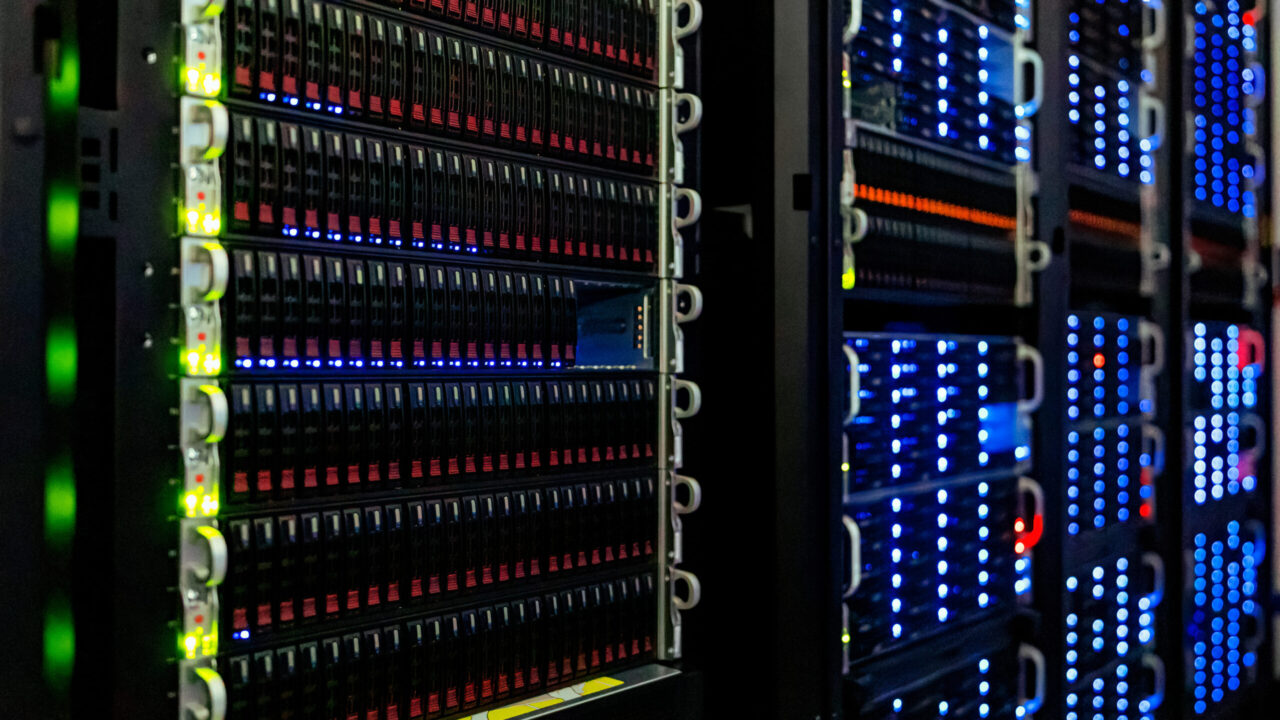 Server racks with glowing indicator lights in a computer server room