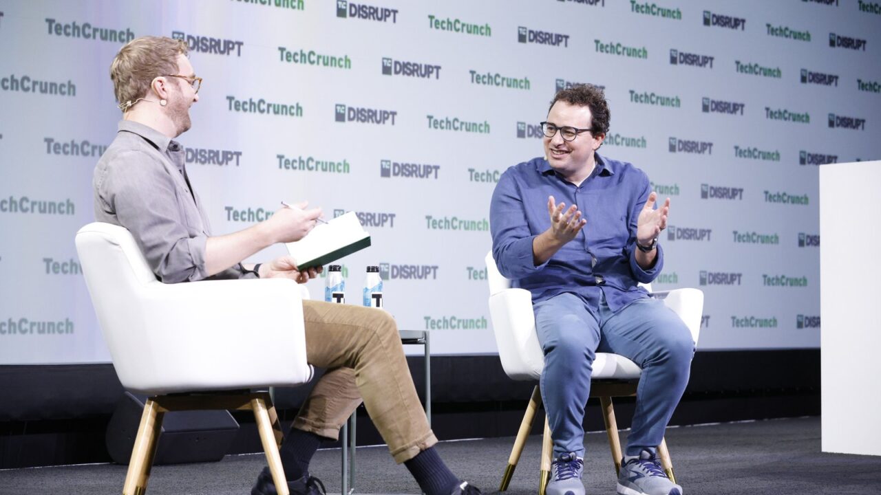 Anthropic cofounder Dario Amodei speaking on stage at a technology conference