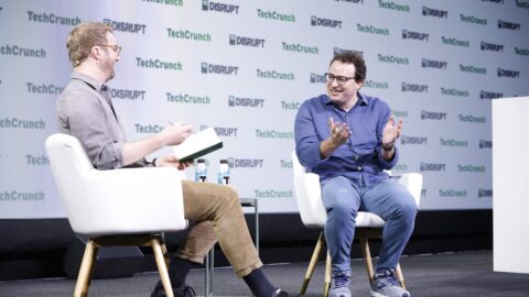 Anthropic cofounder Dario Amodei speaking on stage at a technology conference